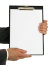 BusinessmanÃ¢â¬â¢s Hands Holding Clipboard